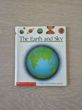 Scholastic The Earth and Sky Hardcover — Blue & Green Cover